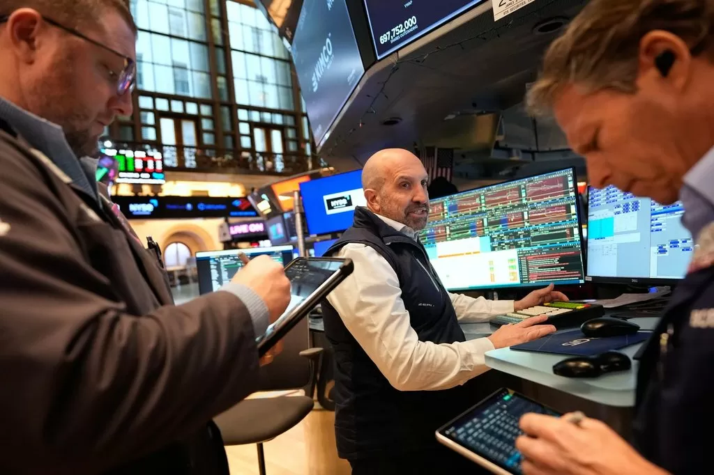 Wall Street, global markets swing in 1st trading day of Iran conflict